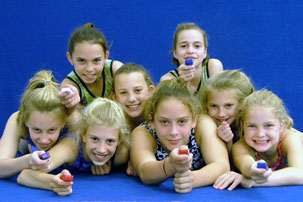 A group of young competitive gymnasts with early and frequent exposure to TAGteaching